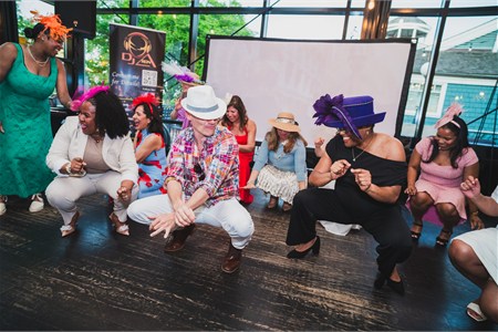 Jeff dancing with a guest during an event celebration